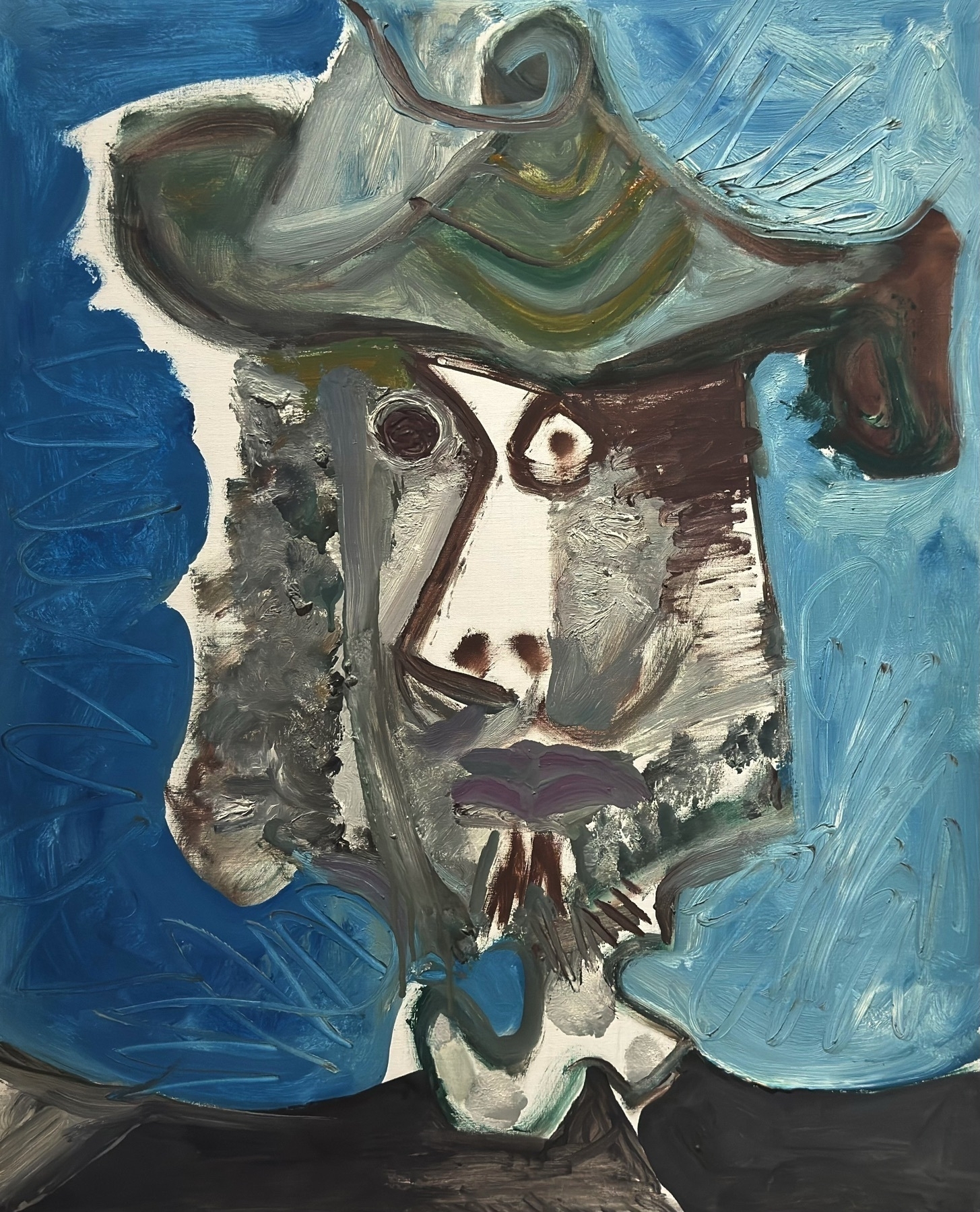 A dynamic portrait of a man wearing a hat, painted in 1971 during Picasso’s late period. The face is aggressively distorted with heavy brushwork and exaggerated features, exemplifying his expressive, almost grotesque self-reflection in old age. The vibrant blue and green background contrasts with the earthy flesh tones, underscoring the emotional intensity and raw vitality of Picasso’s final creative years.