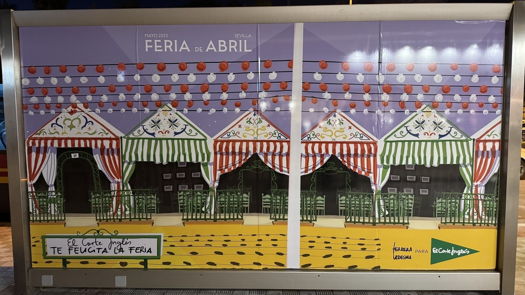 A colorful illustrated poster for the May 2025 fair in Seville, showing festive striped tents and rows of hanging lanterns. The design is playful and decorative, with branding from El Corte Inglés and the artist.