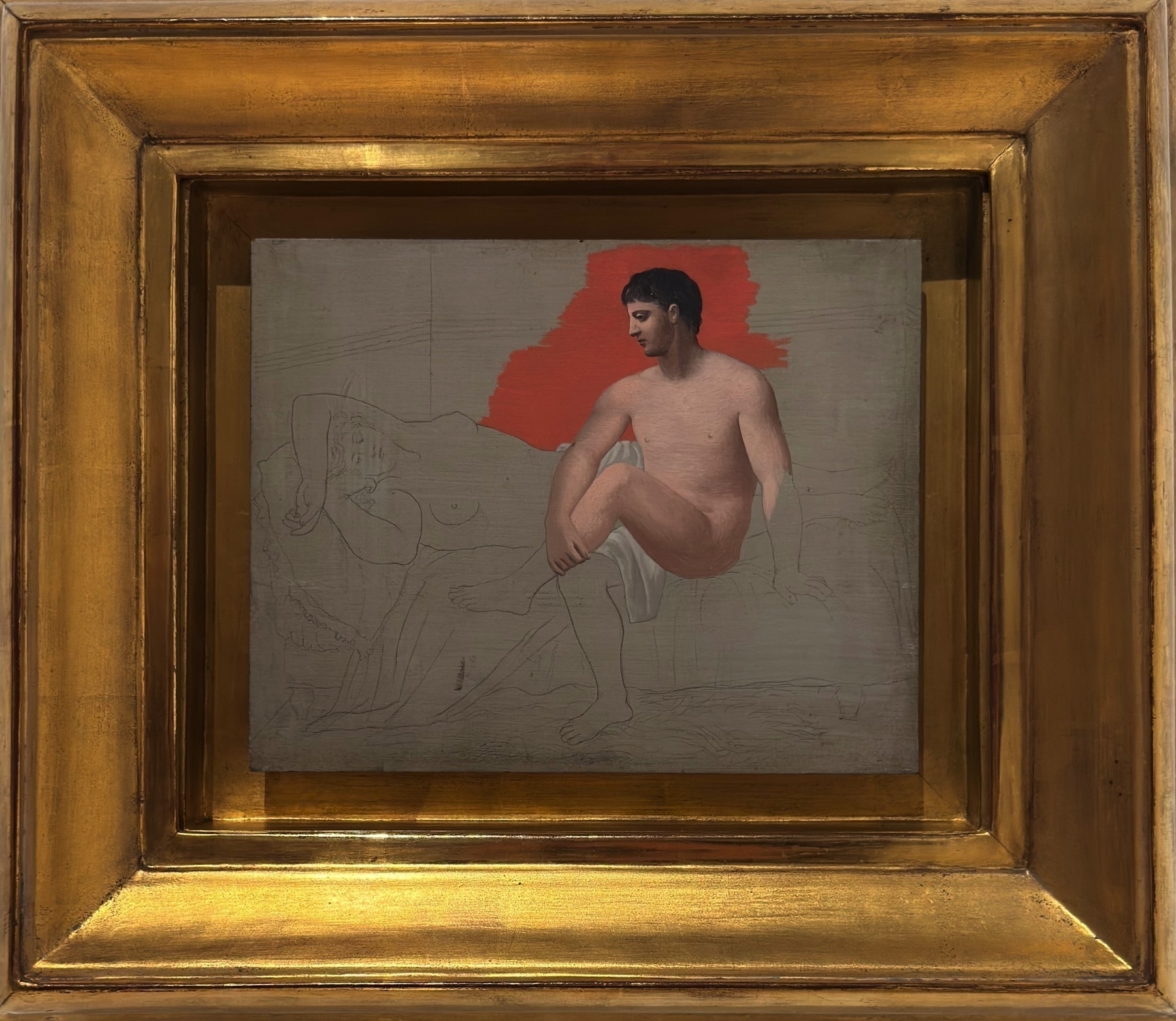 An unfinished neoclassical painting from Picasso’s return to figuration in the 1920s, depicting a seated man gazing at a reclining nude woman. Executed in graphite and oil, the male figure is partially modeled, while the woman remains a loose sketch. A bold red brushstroke in the background disrupts the classical harmony, exemplifying Picasso’s ongoing dialogue between tradition and avant-garde experimentation.