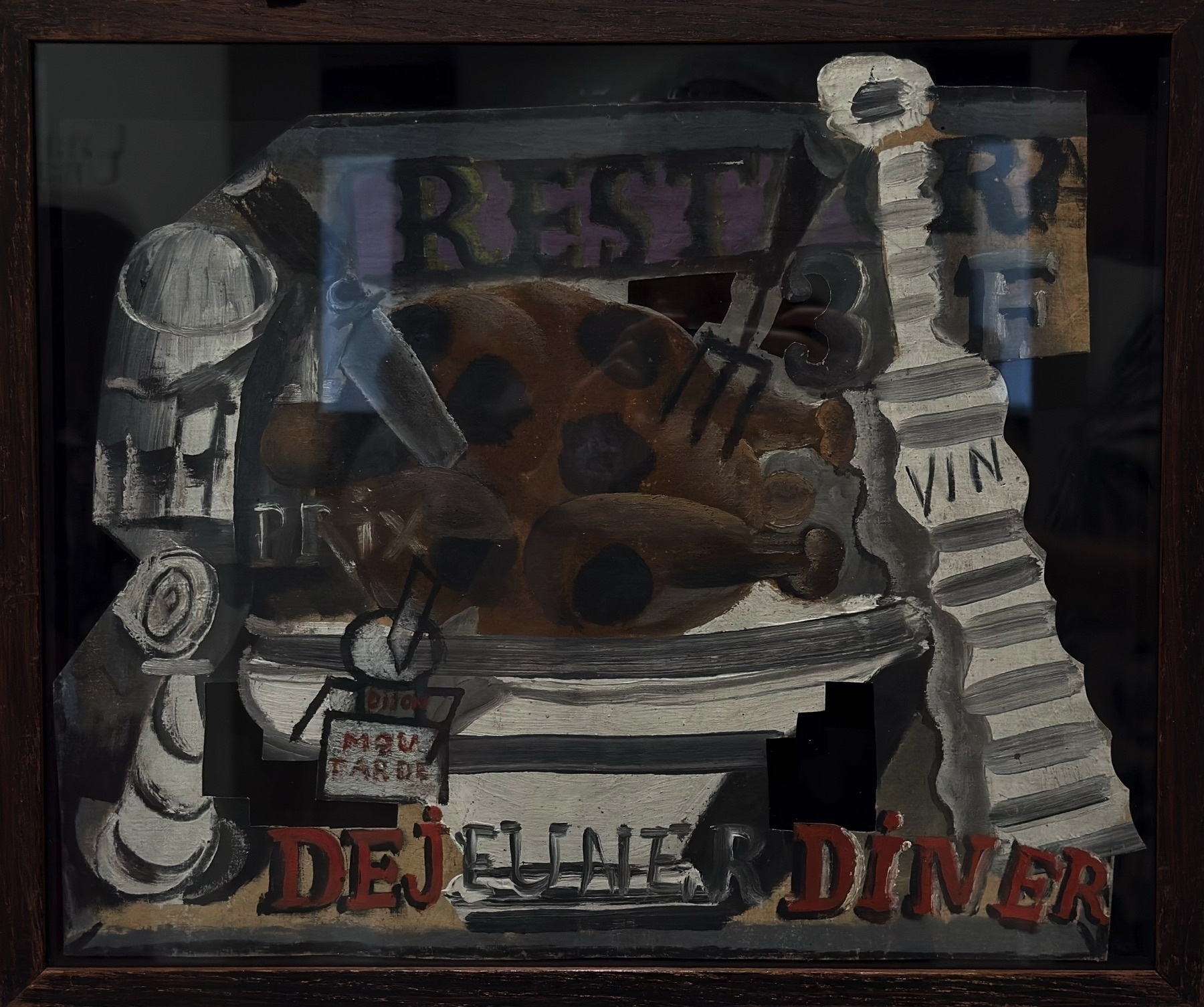 A Cubist still life incorporating collage and painting, featuring fragmented images of a restaurant table, food items, and signage. Words like “DÉJEUNER” and “DINER” are embedded within the scene, a hallmark of Picasso’s Synthetic Cubism. The piece blurs the boundary between everyday life and abstraction, showcasing his pioneering use of commercial typography and layered forms to challenge traditional still life conventions.